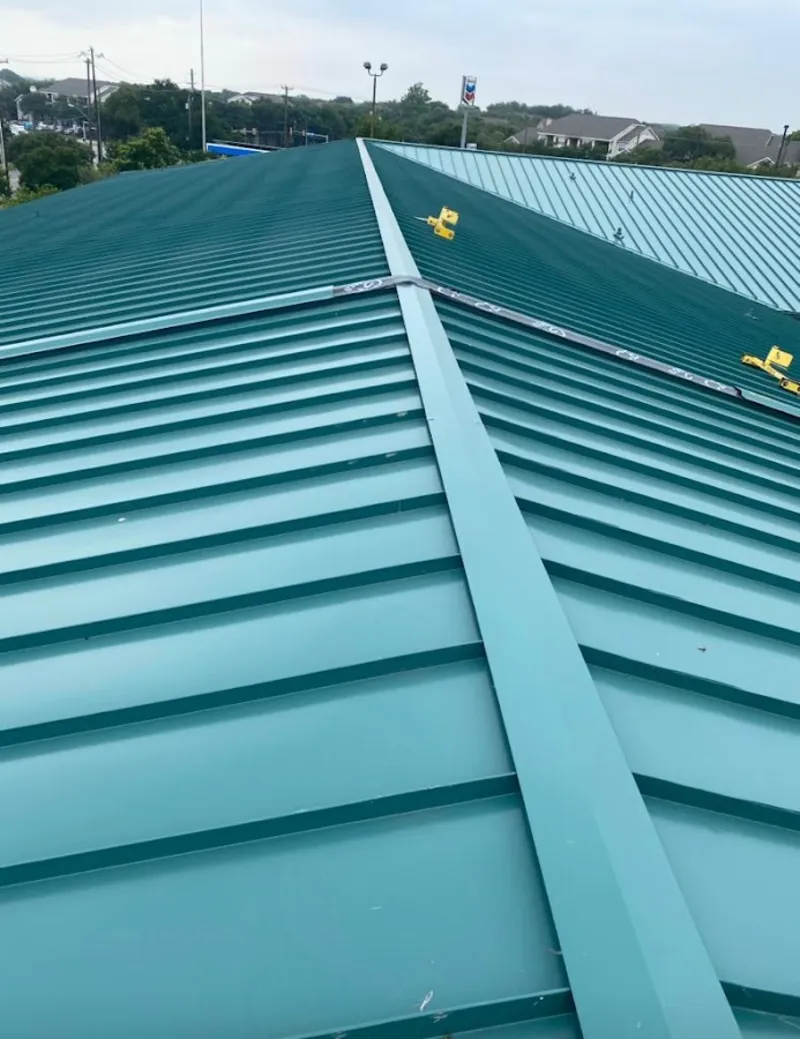 Green commercial metal roof ridge and valley for Metal Roof Repair in Macon-Bibb County